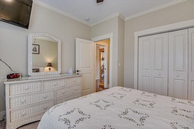 bedroom with a closet and crown molding