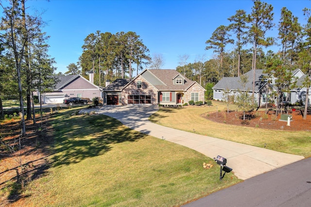 view of front facade featuring driveway, stone siding, and a front lawn