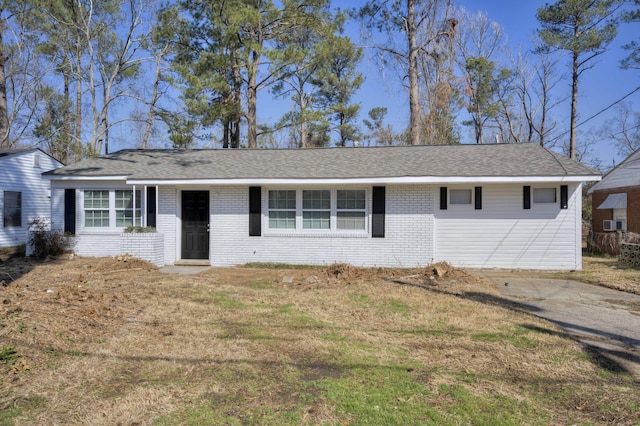 ranch-style home with brick siding and roof with shingles