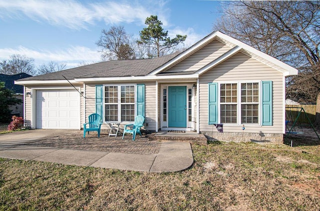 ranch-style home featuring concrete driveway and an attached garage