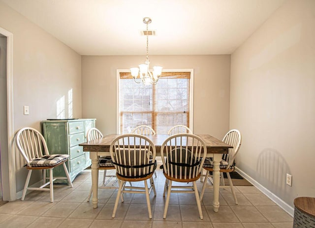 dining area with baseboards, light tile patterned floors, visible vents, and an inviting chandelier