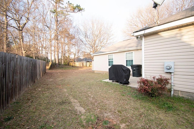 view of yard featuring a patio area and a fenced backyard