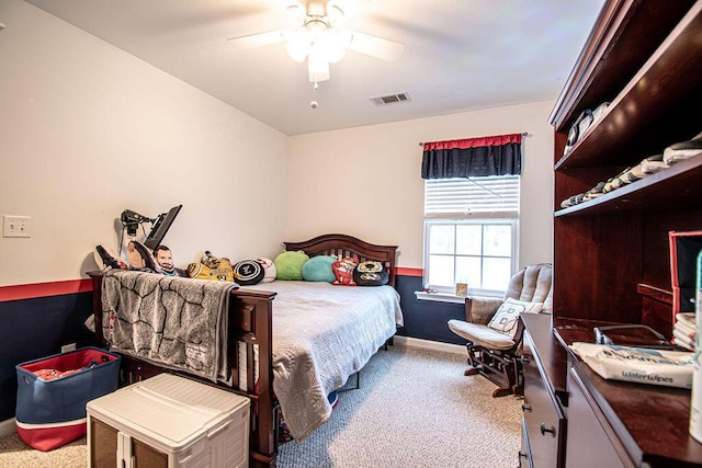 bedroom with carpet floors, visible vents, baseboards, and a ceiling fan