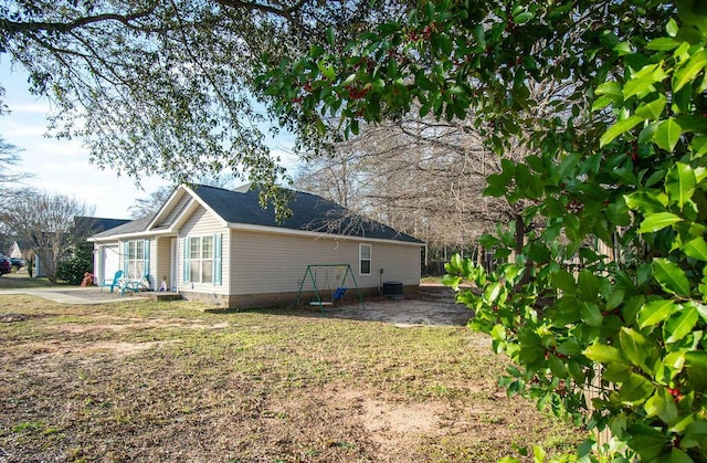 view of home's exterior with cooling unit and a patio area