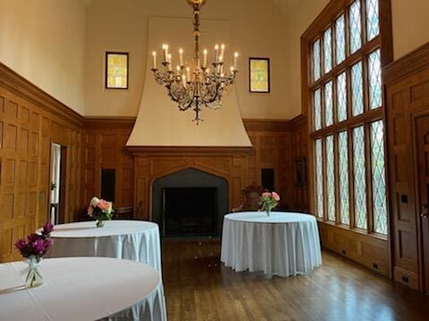 506 Regent Pl, Augusta, GA 30909 - dining room with high vaulted ceiling, healthy amount of natural light, a chandelier, wood finished floors, and a fireplace