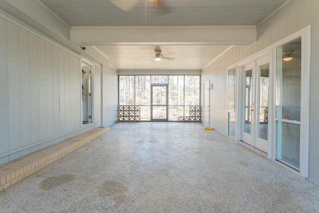 unfurnished sunroom featuring french doors and ceiling fan