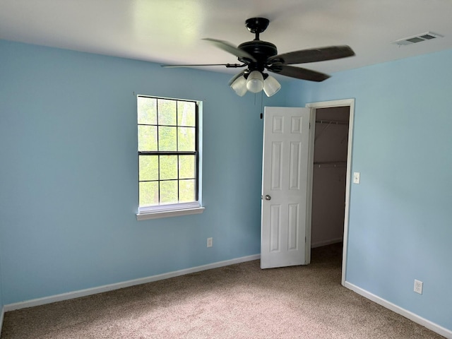 3777 Pine Ridge Run, Martinez, GA 30907 - unfurnished bedroom with a spacious closet, carpet, a closet, and a ceiling fan