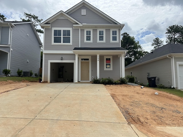 124 Candleberry Dr, North Augusta, SC 29860 - view of front facade with driveway, a porch, and an attached garage