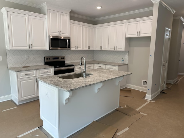 124 Candleberry Dr, North Augusta, SC 29860 - kitchen featuring stainless steel appliances, white cabinets, backsplash, a kitchen island with sink, and ornamental molding