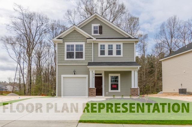 craftsman house with central air condition unit, a garage, and driveway