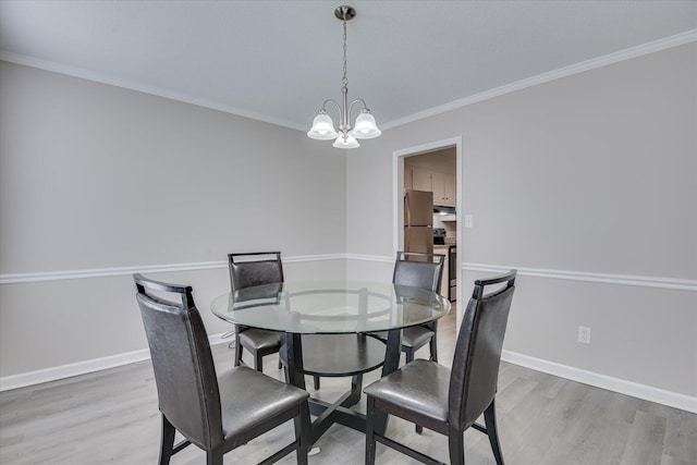 2904 Pleasant Ct, Augusta, GA 30907 - dining space with a chandelier, light wood-style flooring, and crown molding