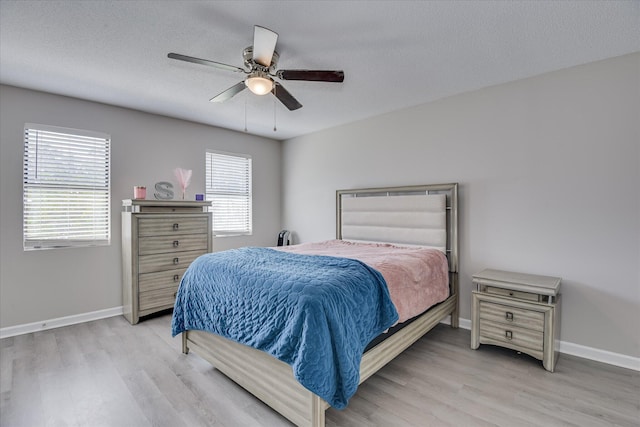 2904 Pleasant Ct, Augusta, GA 30907 - bedroom featuring light wood-style floors, multiple windows, a textured ceiling, and a ceiling fan
