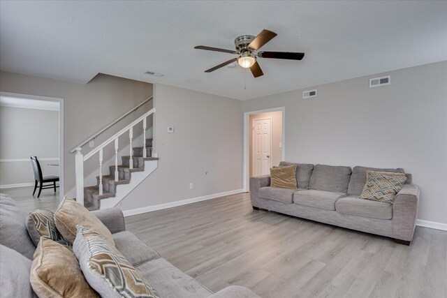 2904 Pleasant Ct, Augusta, GA 30907 - living room with ceiling fan, wood finished floors, and stairway