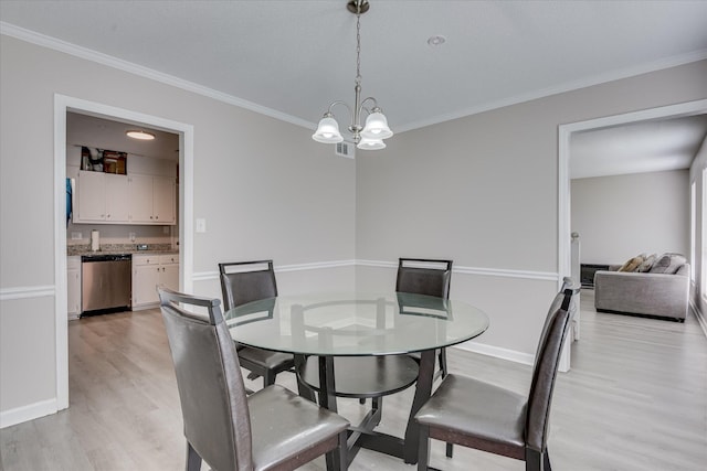 2904 Pleasant Ct, Augusta, GA 30907 - dining room with light wood-style floors, crown molding, and a chandelier