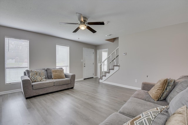 2904 Pleasant Ct, Augusta, GA 30907 - living room with ceiling fan, wood finished floors, and stairway