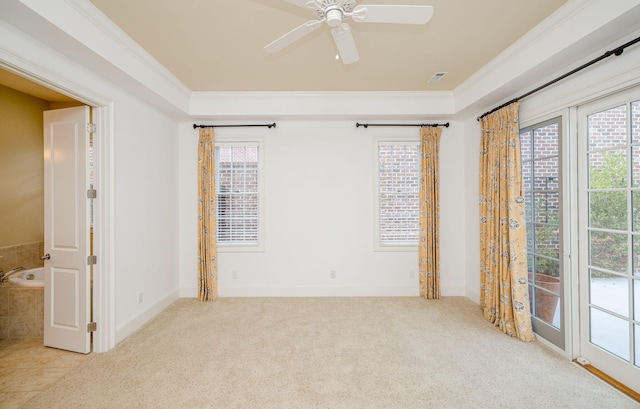 carpeted empty room with ceiling fan and ornamental molding