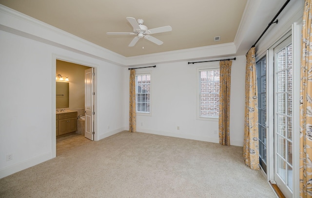 unfurnished bedroom with ceiling fan, light colored carpet, and ornamental molding