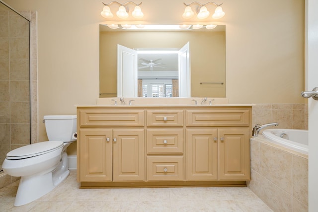 bathroom featuring tile patterned floors, vanity, ceiling fan, tiled tub, and toilet