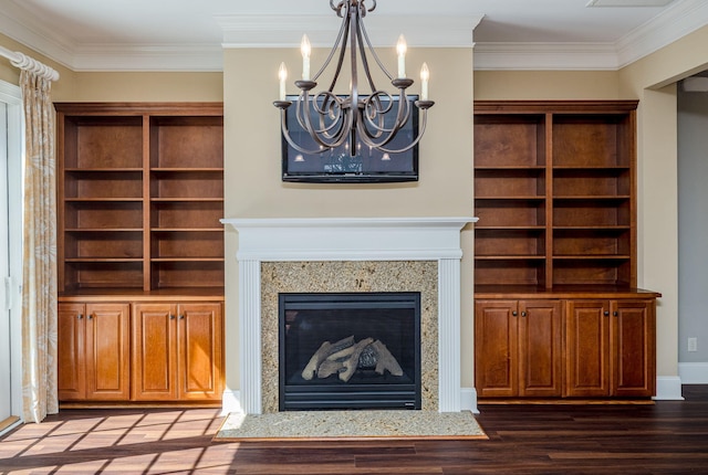 unfurnished living room with wood-type flooring, ornamental molding, and a premium fireplace