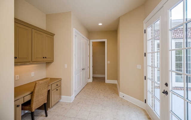 office area featuring built in desk and french doors