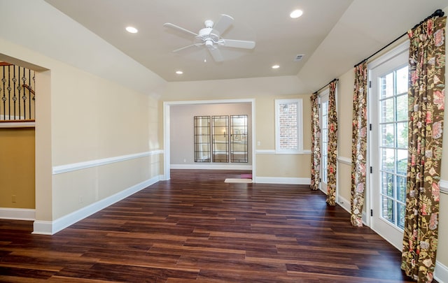 unfurnished room with ceiling fan, dark wood-type flooring, and vaulted ceiling