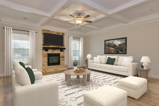 living room featuring beamed ceiling, a healthy amount of sunlight, visible vents, and light wood finished floors