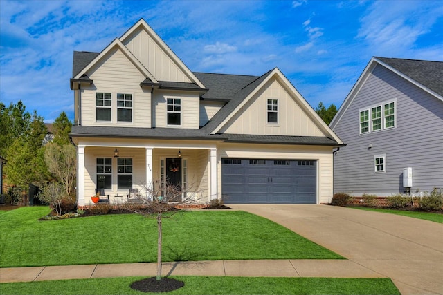 craftsman inspired home featuring driveway, a porch, board and batten siding, and a front yard