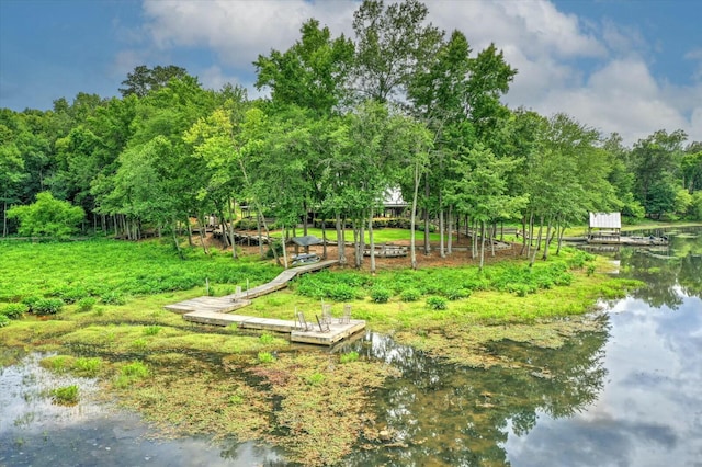 exterior space featuring a water view and a boat dock