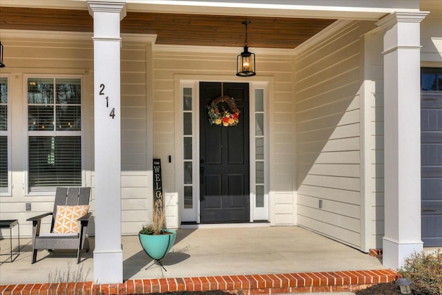 doorway to property featuring a porch