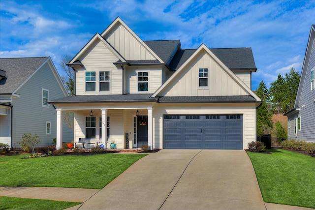 view of front of property featuring covered porch, driveway, board and batten siding, and a front yard