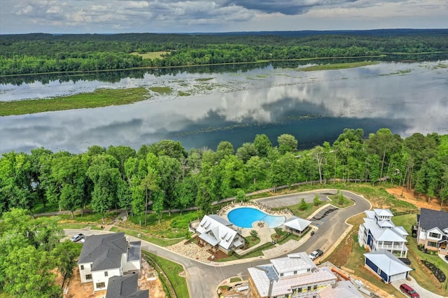 bird's eye view featuring a water view and a wooded view