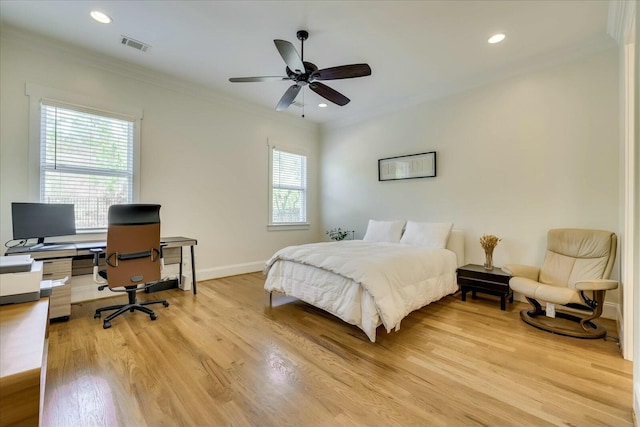 bedroom featuring ornamental molding, recessed lighting, wood finished floors, and baseboards