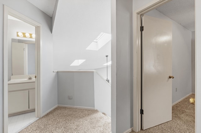 3252 Summerchase Cir, Augusta, GA 30909 - bathroom with a skylight, vanity, and baseboards