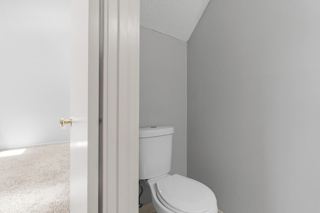 3252 Summerchase Cir, Augusta, GA 30909 - bathroom with toilet, baseboards, and vaulted ceiling