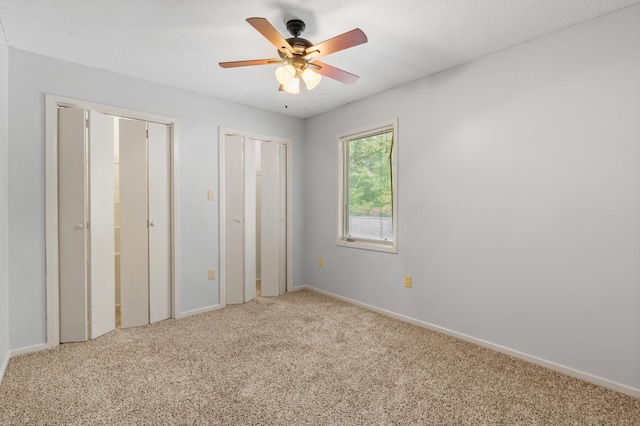 3252 Summerchase Cir, Augusta, GA 30909 - unfurnished bedroom featuring carpet flooring, baseboards, multiple closets, and a ceiling fan