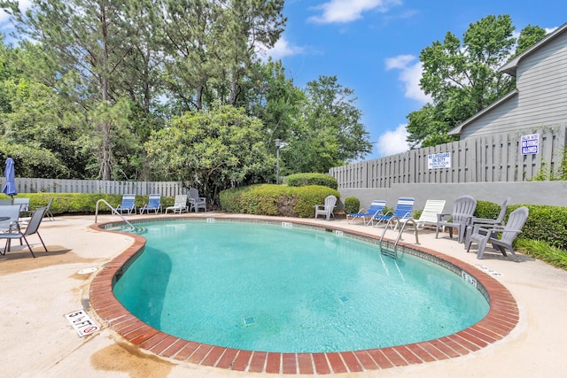 5 Teal Ct, North Augusta, SC 29841 - community pool with a fenced backyard, a patio, and view of scattered trees