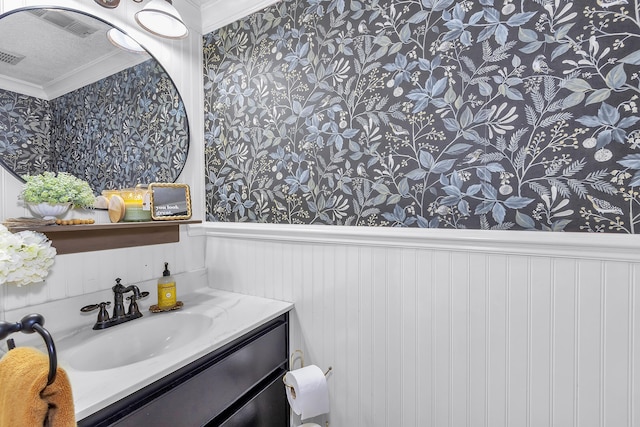 5 Teal Ct, North Augusta, SC 29841 - bathroom featuring wallpapered walls, vanity, crown molding, and a wainscoted wall