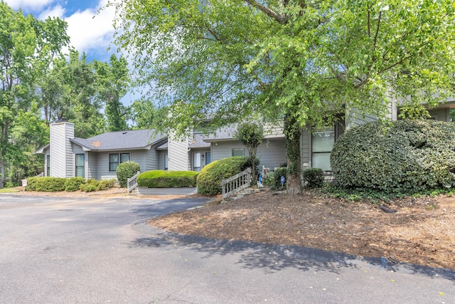 5 Teal Ct, North Augusta, SC 29841 - view of front facade featuring a chimney and asphalt driveway