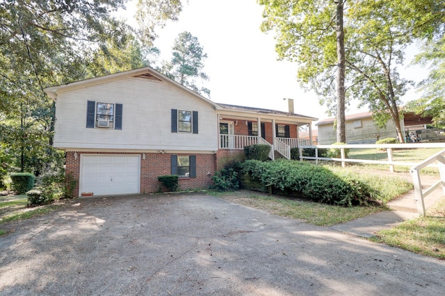 view of front of home featuring a porch and a garage