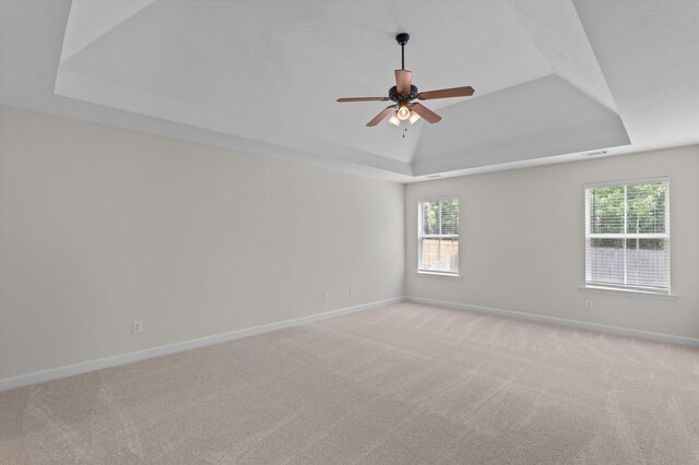 1606 Cedar Hill Dr, Grovetown, GA 30813 - spare room with a tray ceiling, healthy amount of natural light, and light colored carpet