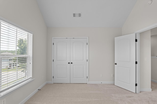 1606 Cedar Hill Dr, Grovetown, GA 30813 - unfurnished bedroom with lofted ceiling, light carpet, and a closet