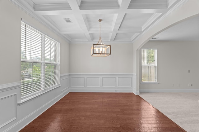 1606 Cedar Hill Dr, Grovetown, GA 30813 - empty room featuring beam ceiling, a chandelier, coffered ceiling, arched walkways, and wood finished floors