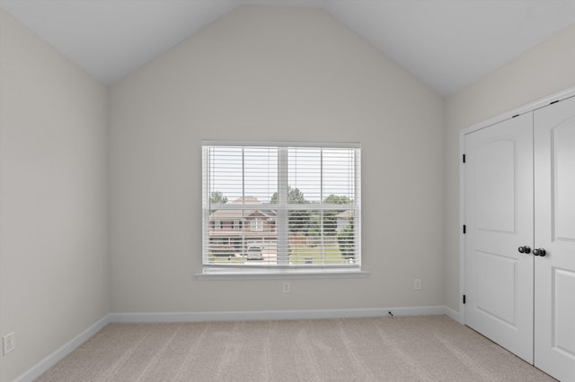 1606 Cedar Hill Dr, Grovetown, GA 30813 - unfurnished bedroom with vaulted ceiling, carpet flooring, and a closet