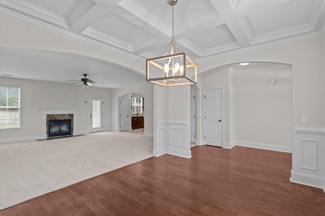 1606 Cedar Hill Dr, Grovetown, GA 30813 - unfurnished living room with arched walkways, wood finished floors, coffered ceiling, ceiling fan, and a high end fireplace