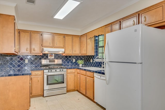 4520 Caliburn Way, Grovetown, GA 30813 - kitchen featuring white appliances, under cabinet range hood, tile countertops, ornamental molding, and decorative backsplash