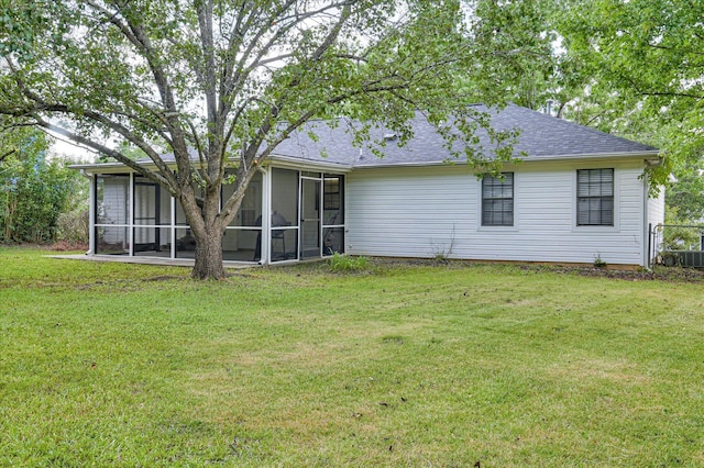 4520 Caliburn Way, Grovetown, GA 30813 - back of house featuring a sunroom, a yard, and a shingled roof