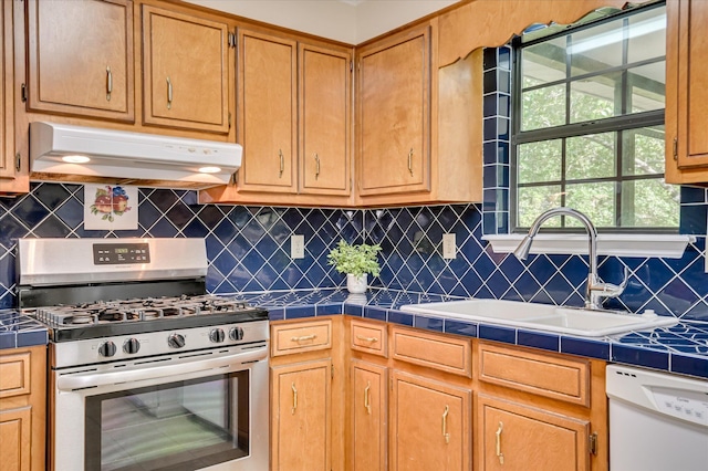 4520 Caliburn Way, Grovetown, GA 30813 - kitchen with stainless steel gas range oven, under cabinet range hood, dishwasher, and tile counters