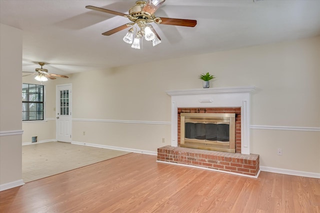 4520 Caliburn Way, Grovetown, GA 30813 - unfurnished living room featuring a ceiling fan, a brick fireplace, and wood finished floors