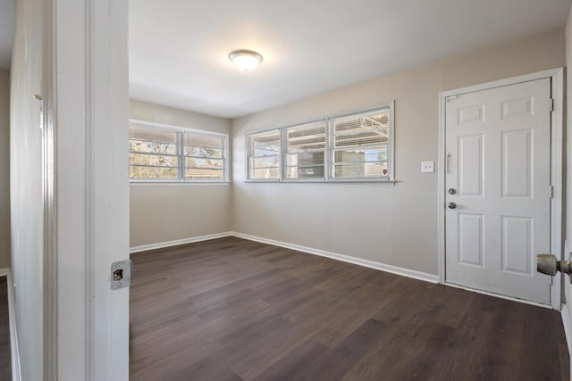 entrance foyer featuring dark wood-style flooring and baseboards