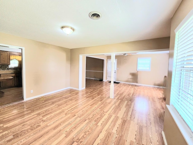 spare room with light hardwood / wood-style flooring